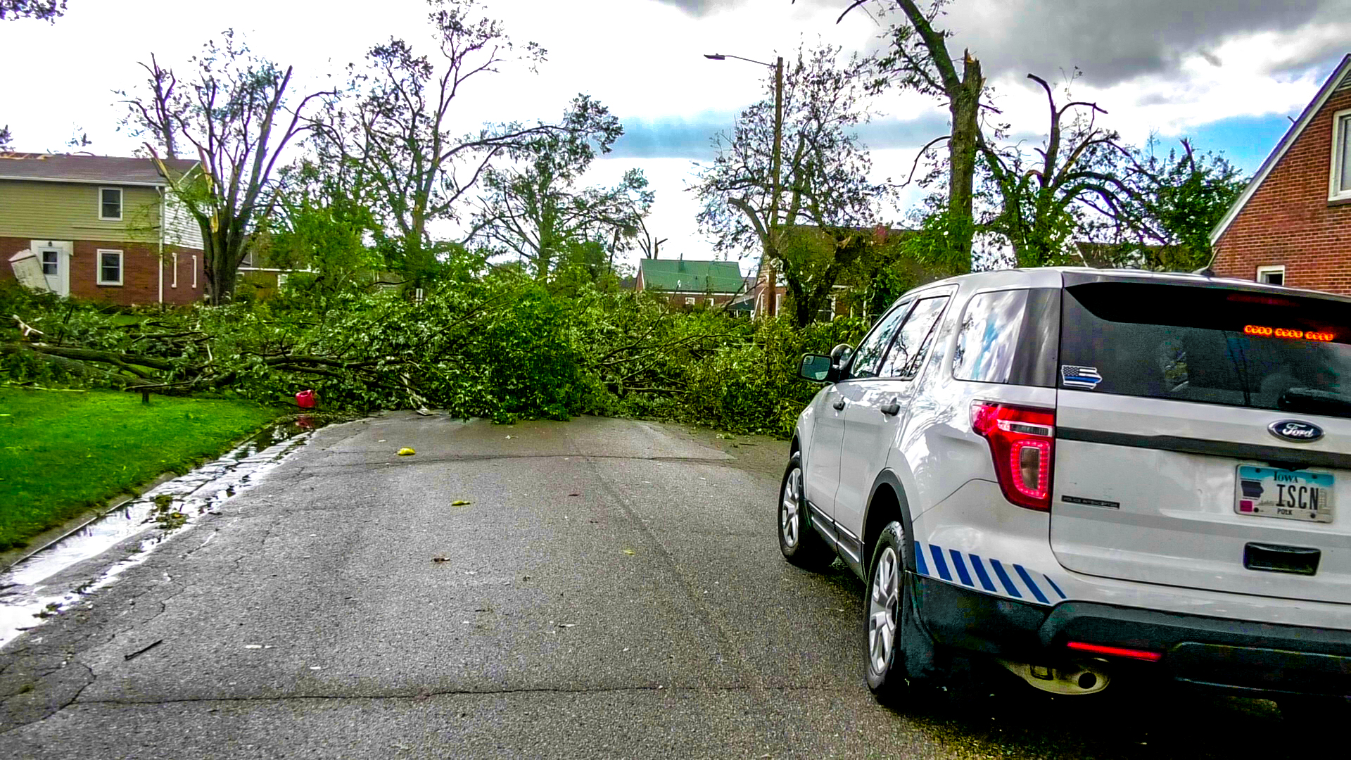 Trees block the road in front of the ISCN SUV after the Marshalltown, IA tornado on July 19th, 2018